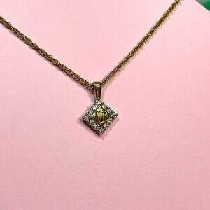 Nina Ricci Necklace 1/2 in Pendant on a 14 in Chain Gold tone Chain